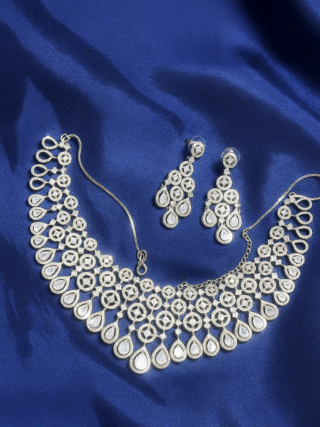 Silver AD necklace set with matching earrings on royal blue fabric – MElegant by LC
