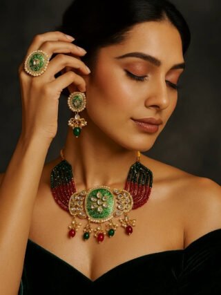 Traditional green meenakari choker necklace with red and green bead strands and matching earrings
