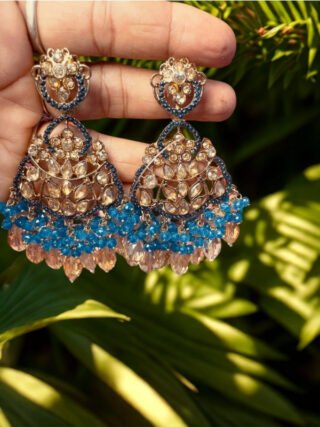 Elegant blue Kundan Chandbali earrings with crystal bead tassels for women, ideal for bridal wear, wedding jewellery, festive occasions and party styling by melegant.