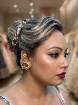 Model wearing ruby-red stone copper earcuff earring from Melegant by LC Indirapuram Ghaziabad