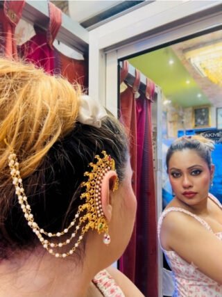 Model wearing copper base temple earcuff with hair chain from Melegant by LC Indirapuram Ghaziabad